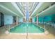Indoor pool area with beautiful decorations and plenty of natural light at 3023 S Atlantic Ave # 8010, Daytona Beach, FL 32118