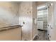 Modern bathroom featuring a tiled shower with glass partition and a walk-in closet at 3027 Portofino Blvd, New Smyrna Beach, FL 32168