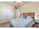 Cozy bedroom with large closets, neutral decor, and a bed with a patterned comforter at 3027 Portofino Blvd, New Smyrna Beach, FL 32168