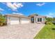 Beautiful single-Gathering home with a three-car garage, stylish stone accents, and a well-manicured front yard at 3027 Portofino Blvd, New Smyrna Beach, FL 32168
