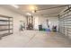 Large garage with overhead lighting, an utility door and plenty of extra space at 3027 Portofino Blvd, New Smyrna Beach, FL 32168
