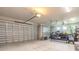 Spacious three car garage with light colored walls and plenty of room for storage and parking at 3027 Portofino Blvd, New Smyrna Beach, FL 32168