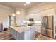 Bright kitchen featuring stainless steel appliances, granite counters, pendant lighting, and a functional island at 3027 Portofino Blvd, New Smyrna Beach, FL 32168