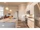 Well-equipped kitchen boasts stainless steel appliances, granite counters, and a spacious island with a sink at 3027 Portofino Blvd, New Smyrna Beach, FL 32168