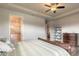 Beautifully furnished bedroom with a ceiling fan and an ensuite bathroom with a marble shower at 3027 Portofino Blvd, New Smyrna Beach, FL 32168
