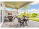 Relaxing screened-in patio featuring comfortable seating and a table with chairs for outdoor dining and lounging at 3027 Portofino Blvd, New Smyrna Beach, FL 32168