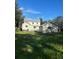 Spacious backyard with detached garage and siding home, perfect for outdoor activities at 306 Murray St, New Smyrna Beach, FL 32168