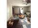 Cozy bedroom with two twin beds, a crib, ceiling fan, and carpeted floors at 306 Murray St, New Smyrna Beach, FL 32168