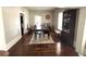 Bright dining room with wood floors, a classic rug, and lots of natural light at 306 Murray St, New Smyrna Beach, FL 32168