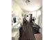 Hallway has wood-look floors, a makeup vanity and lots of natural light at 306 Murray St, New Smyrna Beach, FL 32168