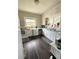 Bright kitchen with white cabinetry, dark countertops, and natural light at 306 Murray St, New Smyrna Beach, FL 32168