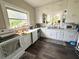 Charming kitchen with white cabinets, modern appliances, and natural lighting at 306 Murray St, New Smyrna Beach, FL 32168