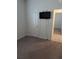 A simple bedroom design featuring neutral carpet, a wall-mounted TV and closet at 3103 Nova Scotia Way, New Smyrna Beach, FL 32168