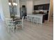 Charming dining and kitchen area with seating for three at the island at 3103 Nova Scotia Way, New Smyrna Beach, FL 32168