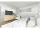 Relaxing bedroom featuring cozy furniture, modern entertainment center, and a light and airy feel at 335 N Causeway # E3, New Smyrna Beach, FL 32169