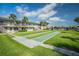 Beautifully maintained community lawn with shuffleboard court and waterfront views, a perfect outdoor space at 335 N Causeway # E3, New Smyrna Beach, FL 32169