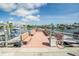 Community dock with benches, offering a relaxing space to enjoy waterfront views and easy access to boating at 335 N Causeway # E3, New Smyrna Beach, FL 32169