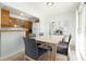Dining area with a table, chairs, and natural light, adjacent to the kitchen at 335 N Causeway # E3, New Smyrna Beach, FL 32169