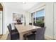 Dining area featuring a wooden table, seating for four, and sliding glass doors at 335 N Causeway # E3, New Smyrna Beach, FL 32169