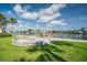 Scenic waterfront dock with stone firepit, perfect for enjoying peaceful sunsets and waterfront living at 335 N Causeway # E3, New Smyrna Beach, FL 32169