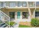 Ground floor condo exterior with patio, sliding glass doors, and easy access to outdoor space at 335 N Causeway # E3, New Smyrna Beach, FL 32169