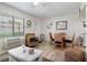 Airy living room and dining area features coastal-inspired decor and plenty of seating at 3509 S Atlantic Ave # 109, New Smyrna Beach, FL 32169