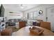 Comfortable living and dining area with nautical decor and an ocean view at 3509 S Atlantic Ave # 109, New Smyrna Beach, FL 32169
