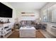 Cozy living room features a sofa, nautical decor, and natural light at 3509 S Atlantic Ave # 109, New Smyrna Beach, FL 32169
