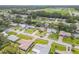 Aerial view of the neighborhood with lush landscaping and a pond at 357 Hearthstone Ter, Port Orange, FL 32127