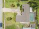 Aerial view of the property showcasing the backyard pool and driveway at 357 Hearthstone Ter, Port Orange, FL 32127