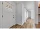 Bright and airy entry hall featuring a white door, clean lines, and durable flooring. Window view at 357 Hearthstone Ter, Port Orange, FL 32127