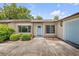 Close-up of a one-story home showcasing a light blue front door and charming curb appeal at 357 Hearthstone Ter, Port Orange, FL 32127