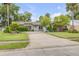 Charming single-story home with a well-maintained lawn, a light blue door and plenty of curb appeal at 357 Hearthstone Ter, Port Orange, FL 32127