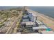 Expansive aerial view showcasing a beachfront condo with easy access to the ocean at 3615 S Atlantic Ave # 211, Daytona Beach, FL 32118