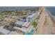 Beautiful aerial view of a beachfront resort with multiple pools and ocean access at 3615 S Atlantic Ave # 211, Daytona Beach, FL 32118