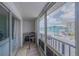 Screened balcony with seating offers outdoor living space with neighborhood views at 3615 S Atlantic Ave # 211, Daytona Beach, FL 32118