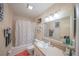 Standard bathroom features a tub with shower, toilet, and large vanity at 3615 S Atlantic Ave # 211, Daytona Beach, FL 32118