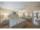 Bright bedroom with carpeted floors, mirror closet, and beach themed bedding at 3615 S Atlantic Ave # 211, Daytona Beach, FL 32118