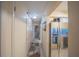 Hallway view of a stainless steel refrigerator and multiple doors at 3615 S Atlantic Ave # 211, Daytona Beach, FL 32118