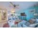Living room area with aqua blue wall, open to bar style seating and kitchen at 3615 S Atlantic Ave # 211, Daytona Beach, FL 32118