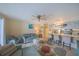 Living room area with bar style seating, opening to the kitchen at 3615 S Atlantic Ave # 211, Daytona Beach, FL 32118