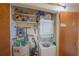 Utility room offers a washer/dryer hookup, water heater, storage shelves and circuit panel at 3615 S Atlantic Ave # 211, Daytona Beach, FL 32118