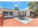 Charming outdoor dining area on the wooden deck offers a tranquil space for enjoying meals and the surrounding views at 3626 Donna St, Port Orange, FL 32129