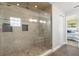 Modern bathroom featuring a glass-enclosed shower with a built-in seat and tiled walls at 3626 Donna St, Port Orange, FL 32129