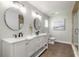 Bathroom with double vanity, tile floors, and walk-in shower at 3626 Donna St, Port Orange, FL 32129