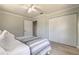 Bedroom with a ceiling fan, closet, and view into the hall at 3626 Donna St, Port Orange, FL 32129
