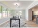 Bright dining room with many windows and a door leading to the outside deck at 3626 Donna St, Port Orange, FL 32129
