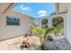 Beautifully landscaped courtyard with decorative white stones and elegant wrought-iron accents at 3626 Donna St, Port Orange, FL 32129