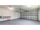 Spacious garage with an automatic door, painted walls, and a clean floor, ideal for storage or a workshop at 3626 Donna St, Port Orange, FL 32129