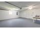 Garage with new painted walls, a ceiling fan and plenty of space for storage at 3626 Donna St, Port Orange, FL 32129